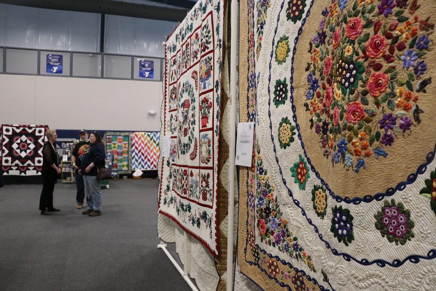 This quilt to the right was selling for $13,200 and the quilt on the right for $5,500 at the Kalona Quilt Show & Sale on April 28-30.